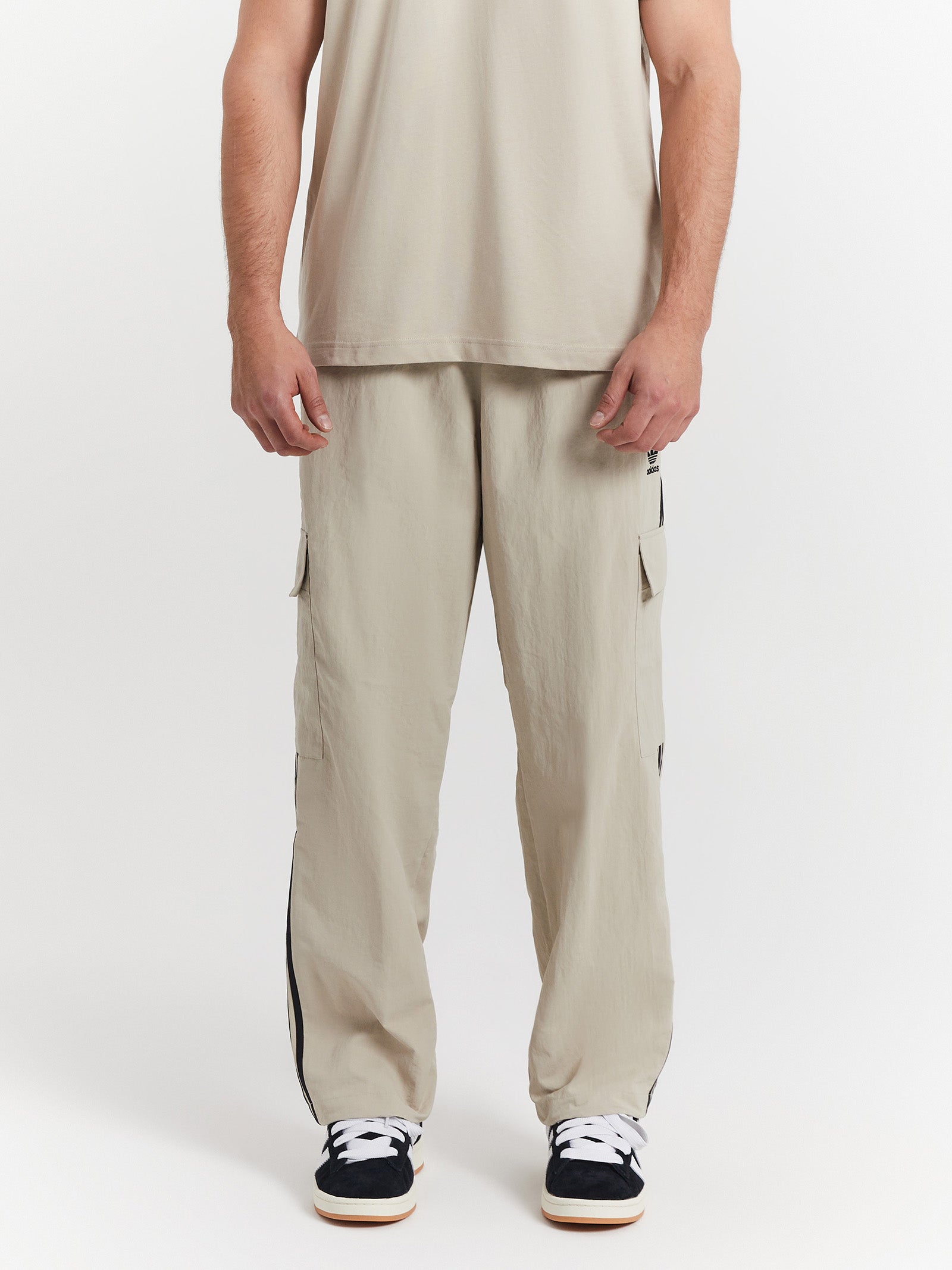 Adidas originals three stripe track pants in on sale khaki