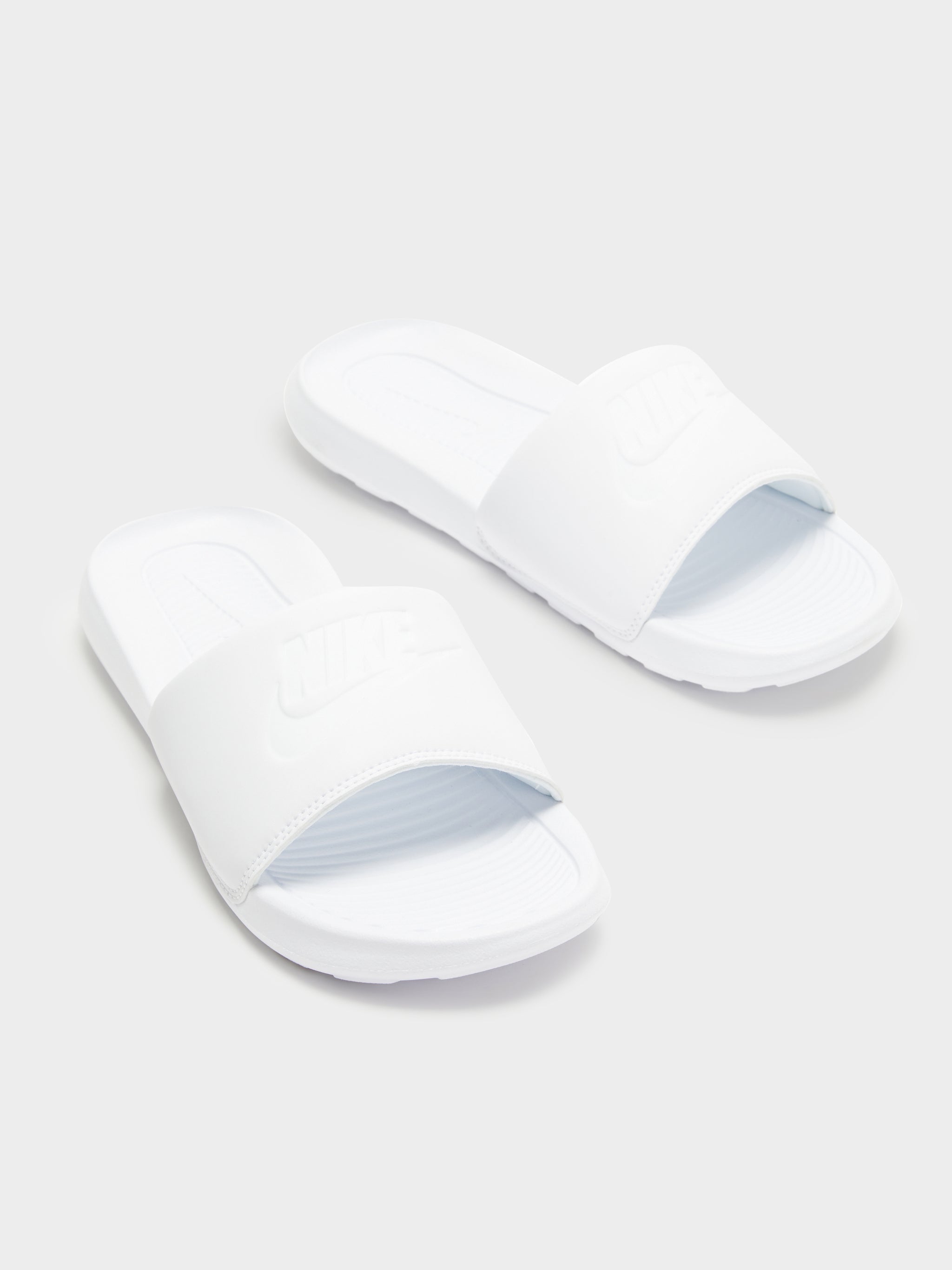 Black and white store nike slides womens