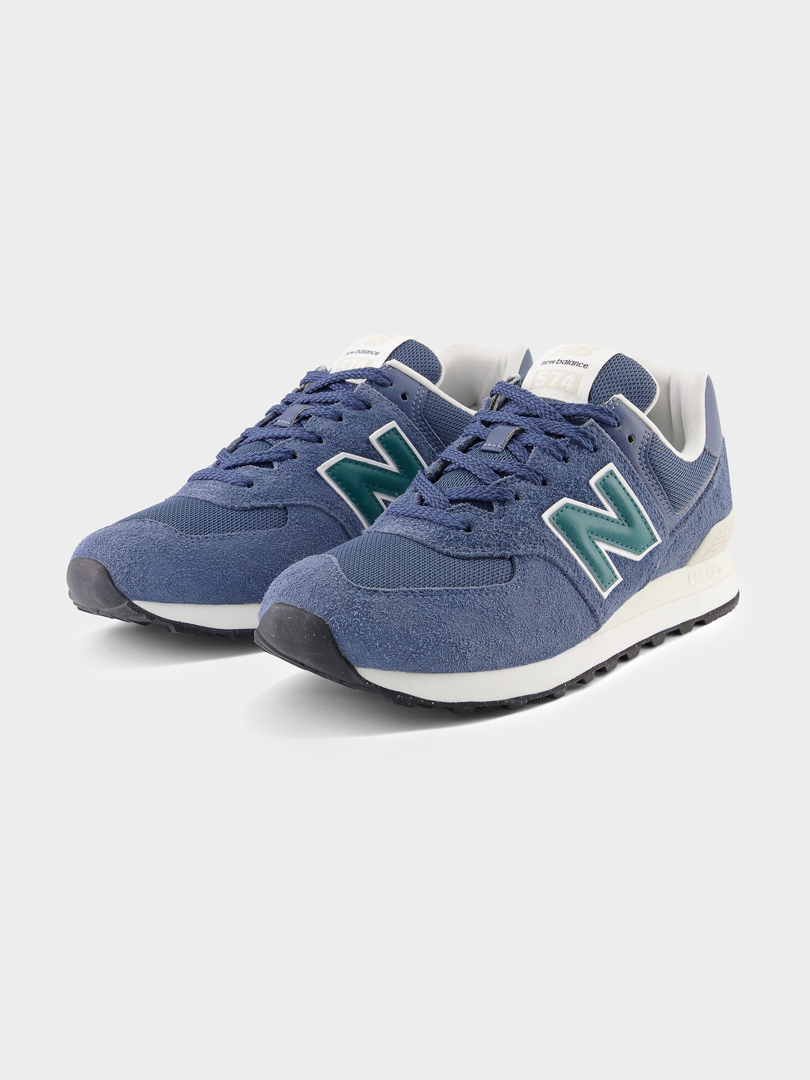 New balance Unisex 574 Sneakers in Navy & Green | Glue Store