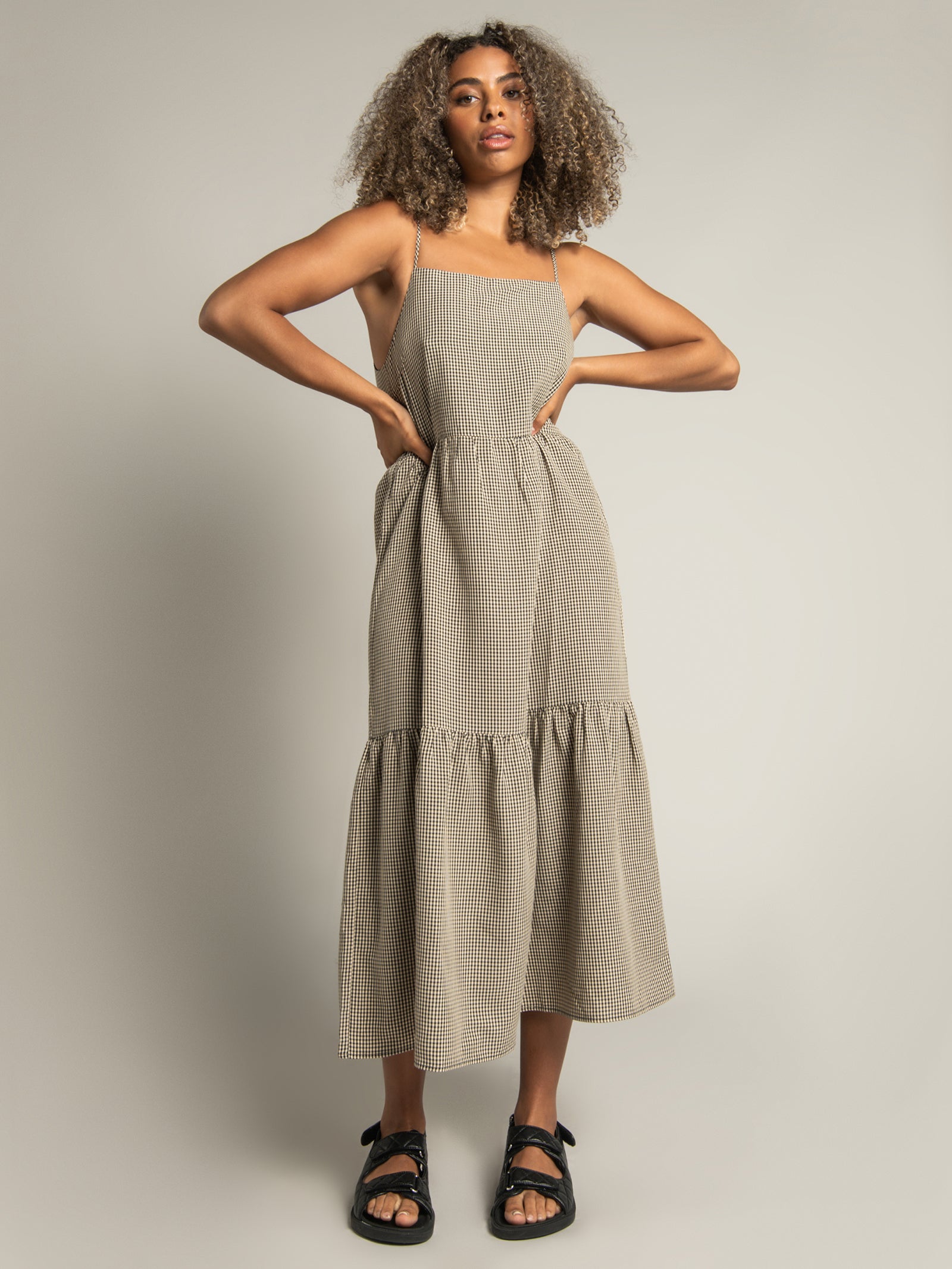 a Gabbie Tiered Midi Dress in Black Tan Gingham Check Glue Store