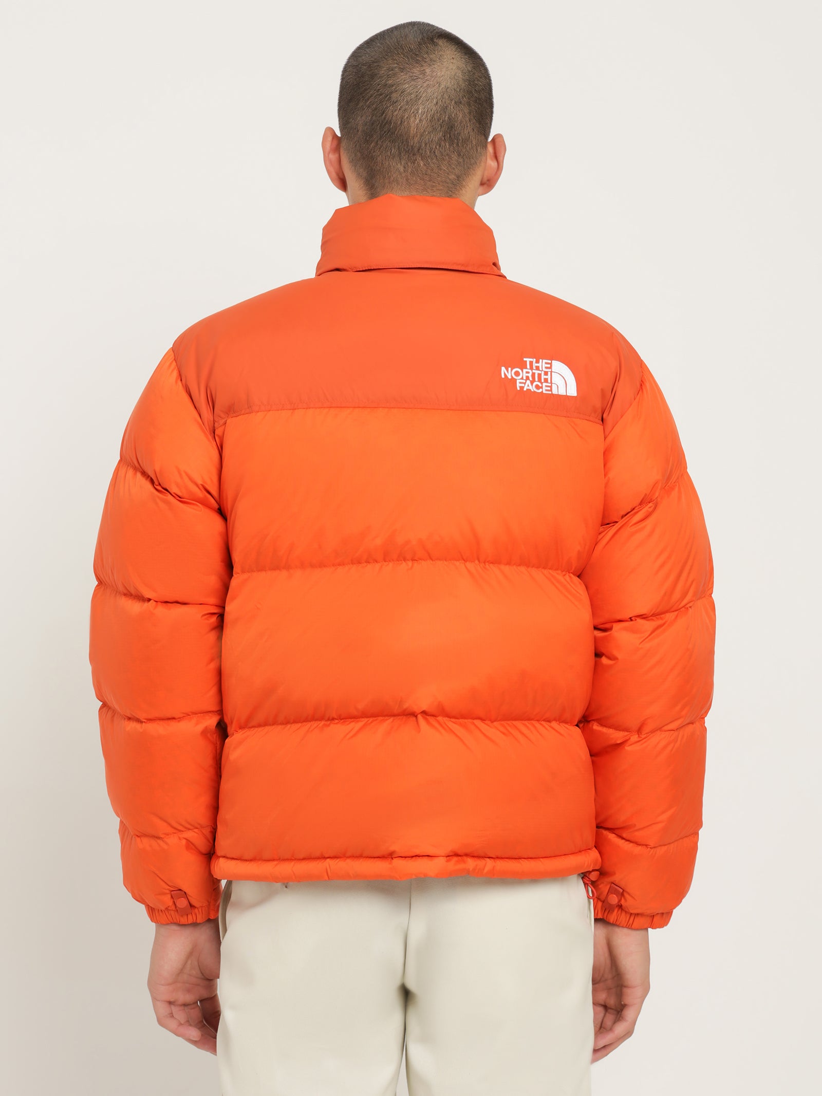 The north face 1996 Retro Nuptse Puffer Jacket in Orange | Glue Store