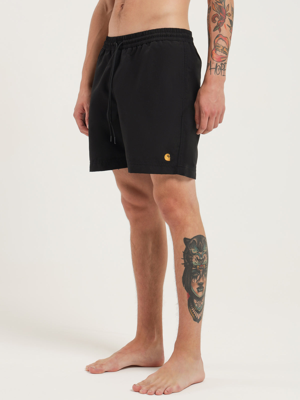 Carhartt Wip Chase Swim Trunks in Black & Gold | Black/Gold