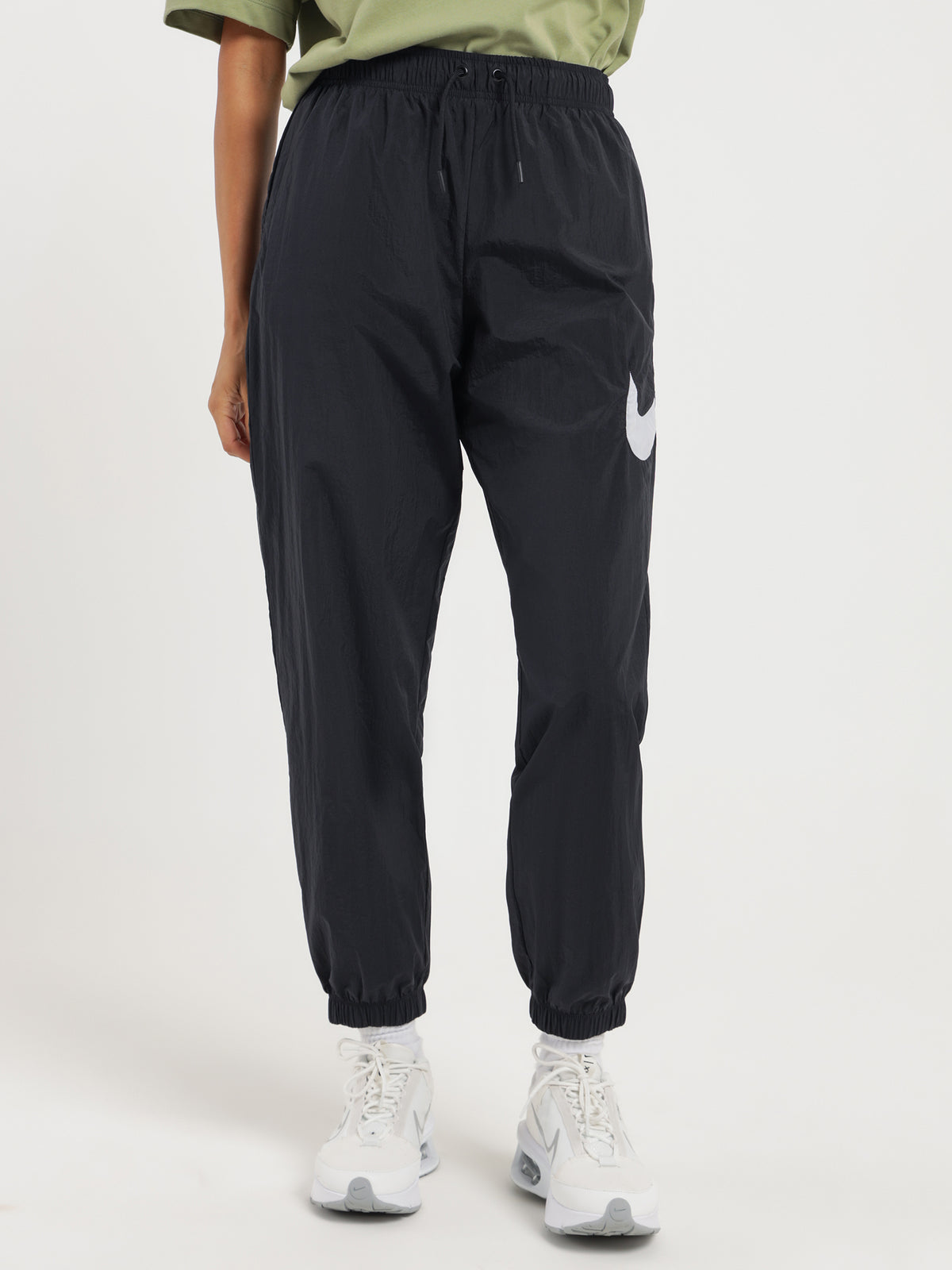 Nike Sportswear Essentials Mid-Rise Track Pants in Black & White | Black/White