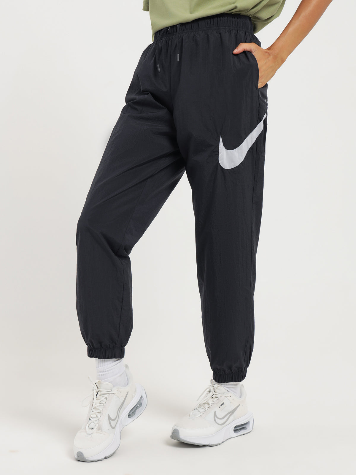 Nike Sportswear Essentials Mid-Rise Track Pants in Black & White | Black/White