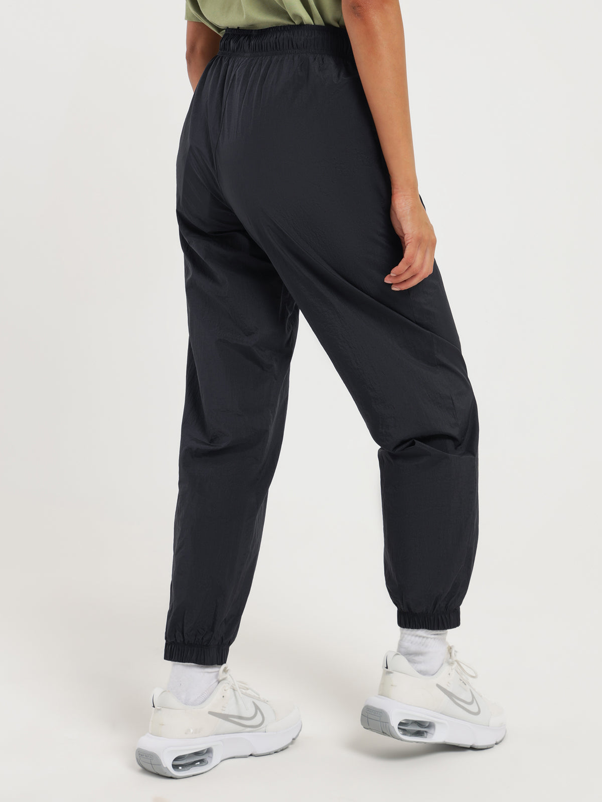 Nike Sportswear Essentials Mid-Rise Track Pants in Black & White | Black/White