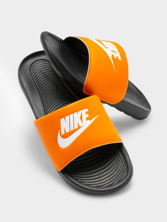 Orange and hot sale blue nike slides