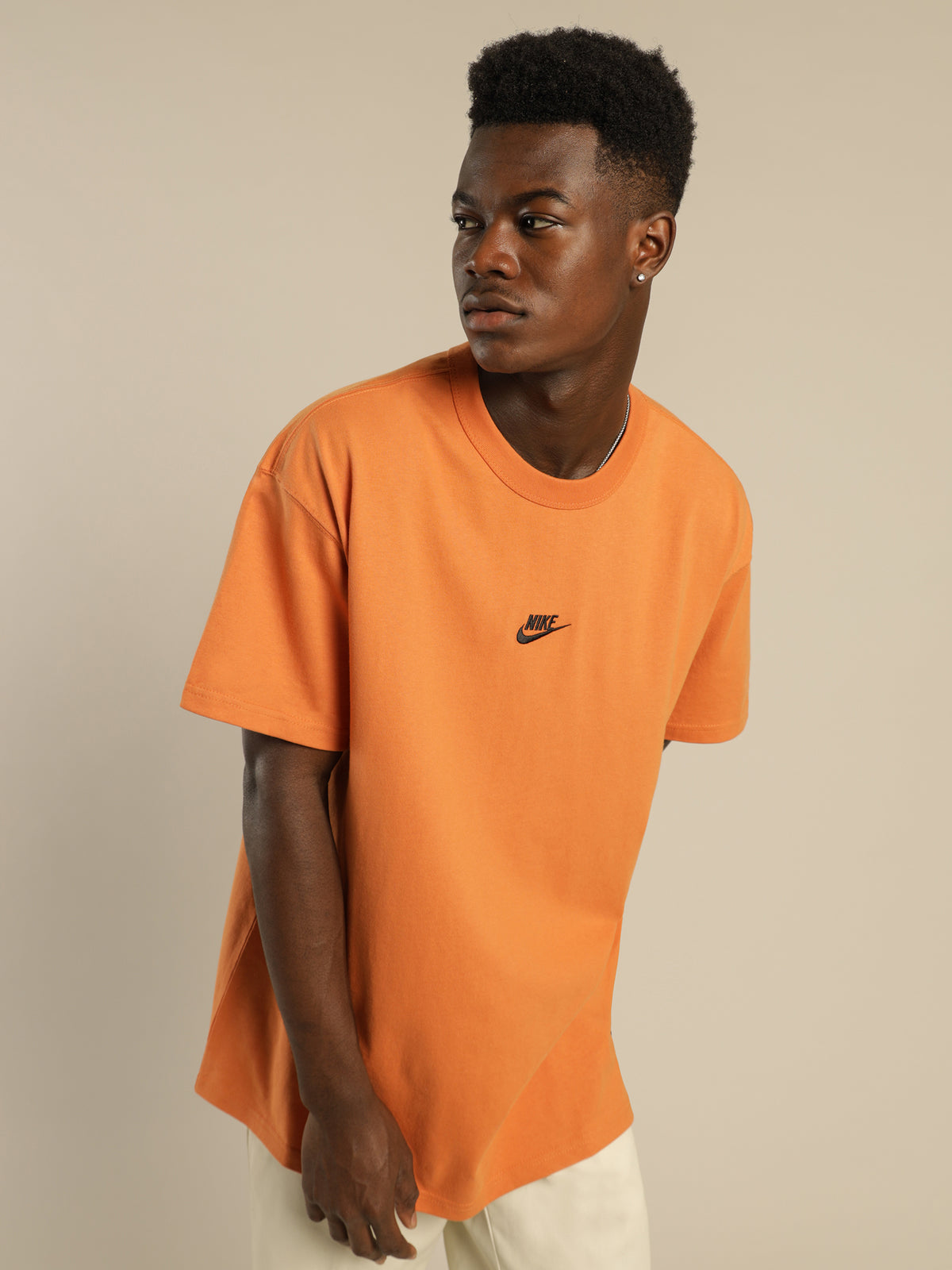 Nike Sportswear Premium Essentials T-Shirt in Hot Curry Orange | Orange