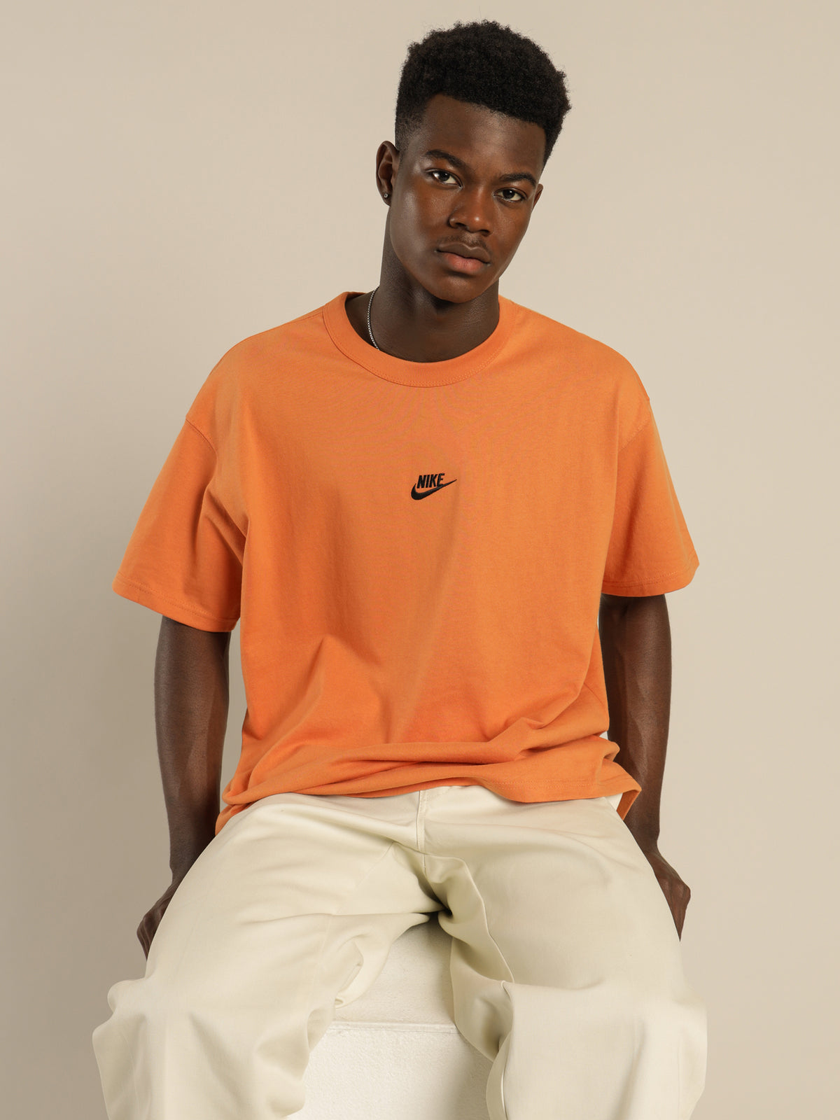 Nike Sportswear Premium Essentials T-Shirt in Hot Curry Orange | Orange