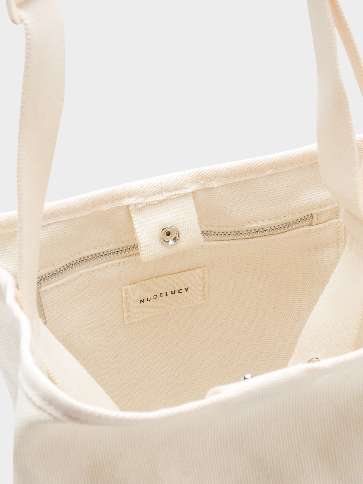 Nude Lucy Canvas Bucket Bag in White | Cloud