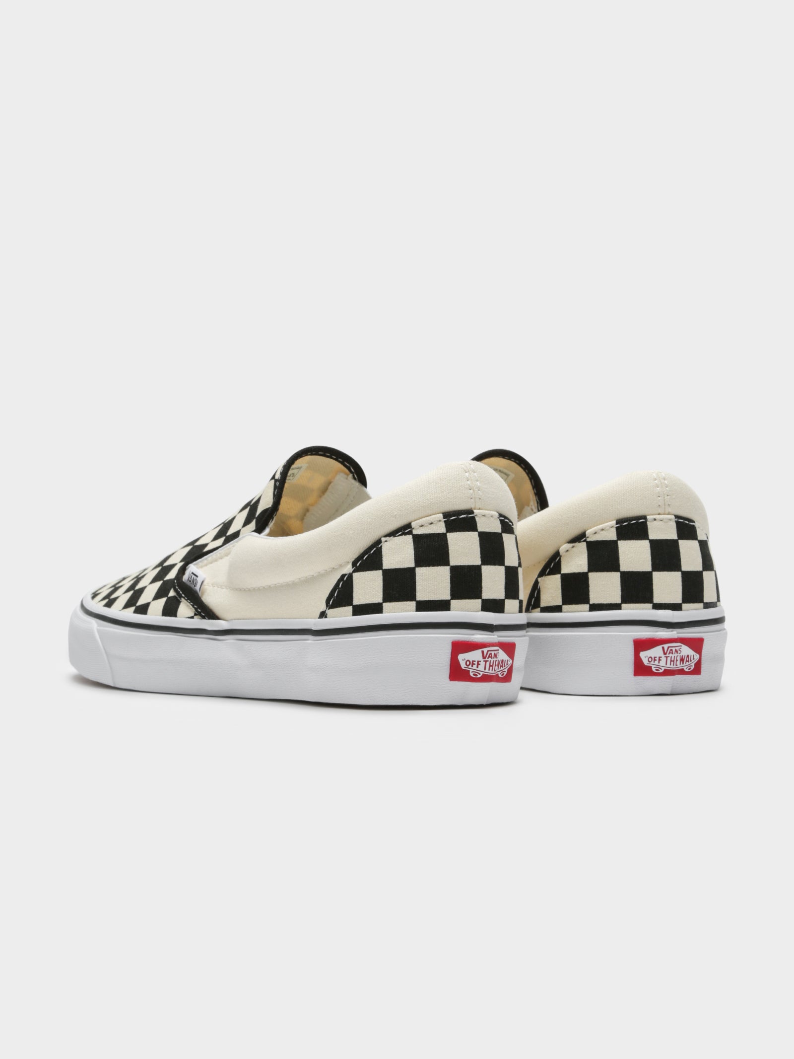 Unisex Classic Slip-On Sneakers in Black and White Checkerboard