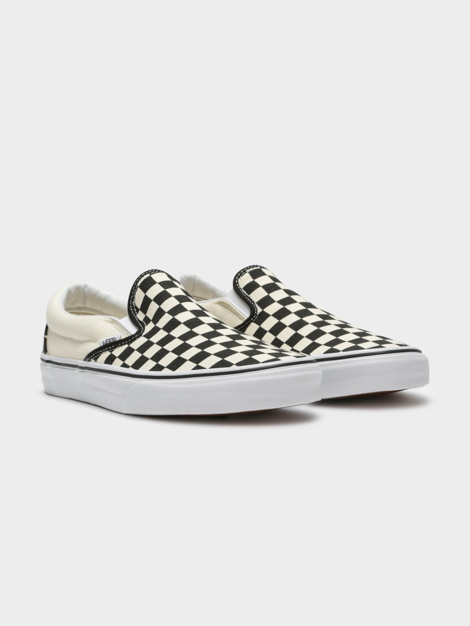 Unisex Classic Slip-On Sneakers in Black and White Checkerboard