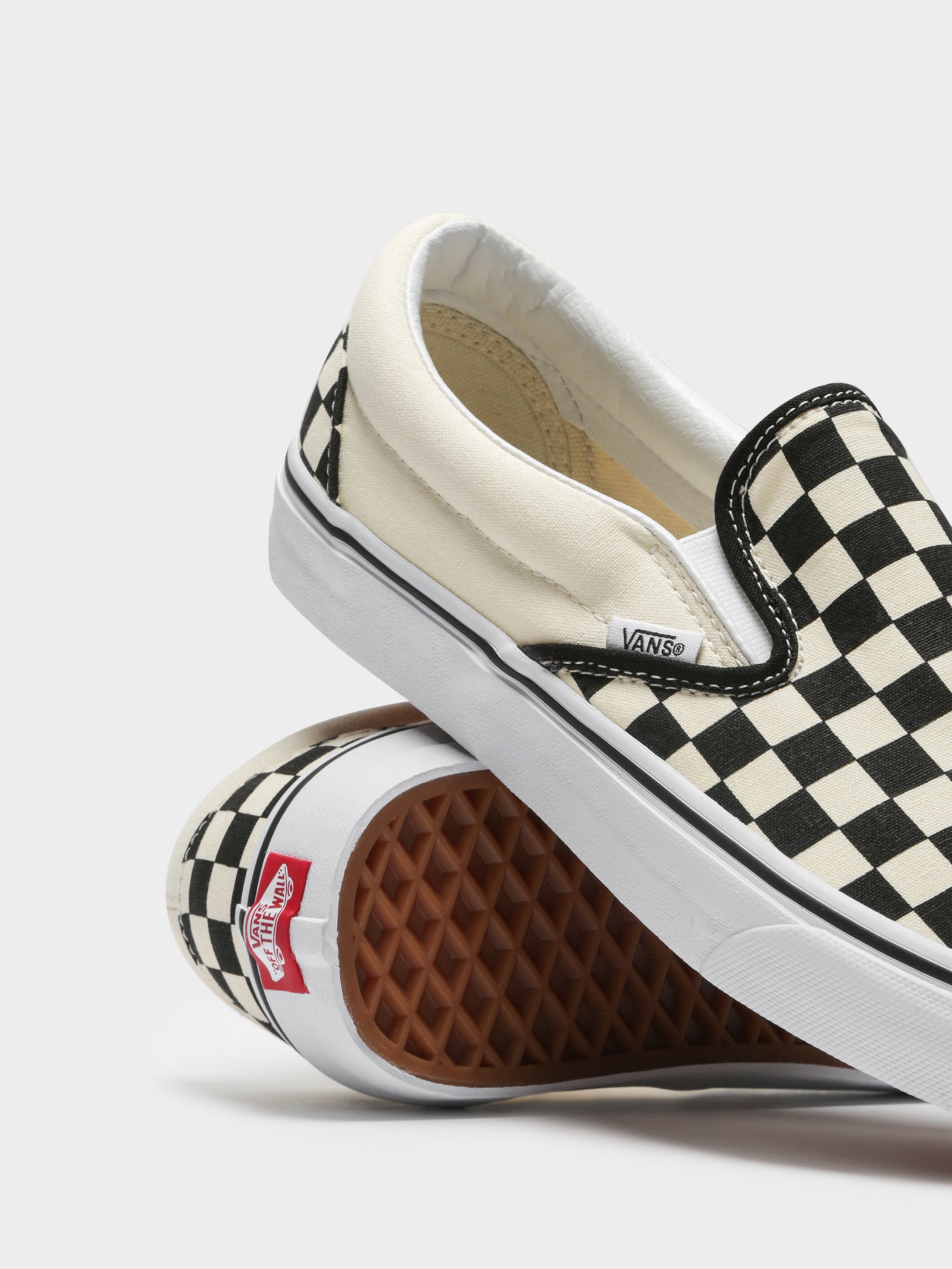 Unisex Classic Slip-On Sneakers in Black and White Checkerboard